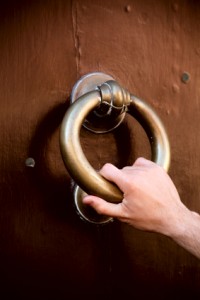 hand knocking at door