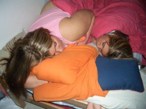 two girls sleeping together