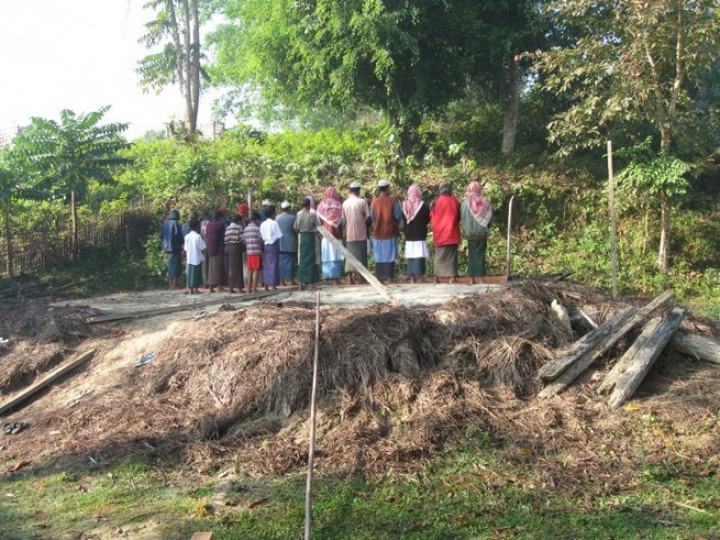 A few remaining Rohingyas in a village of Maungdaw town praying on the mosque's ground after the mosque was demolised.