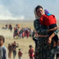 Yazidi woman with her children