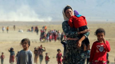 Yazidi woman with her children